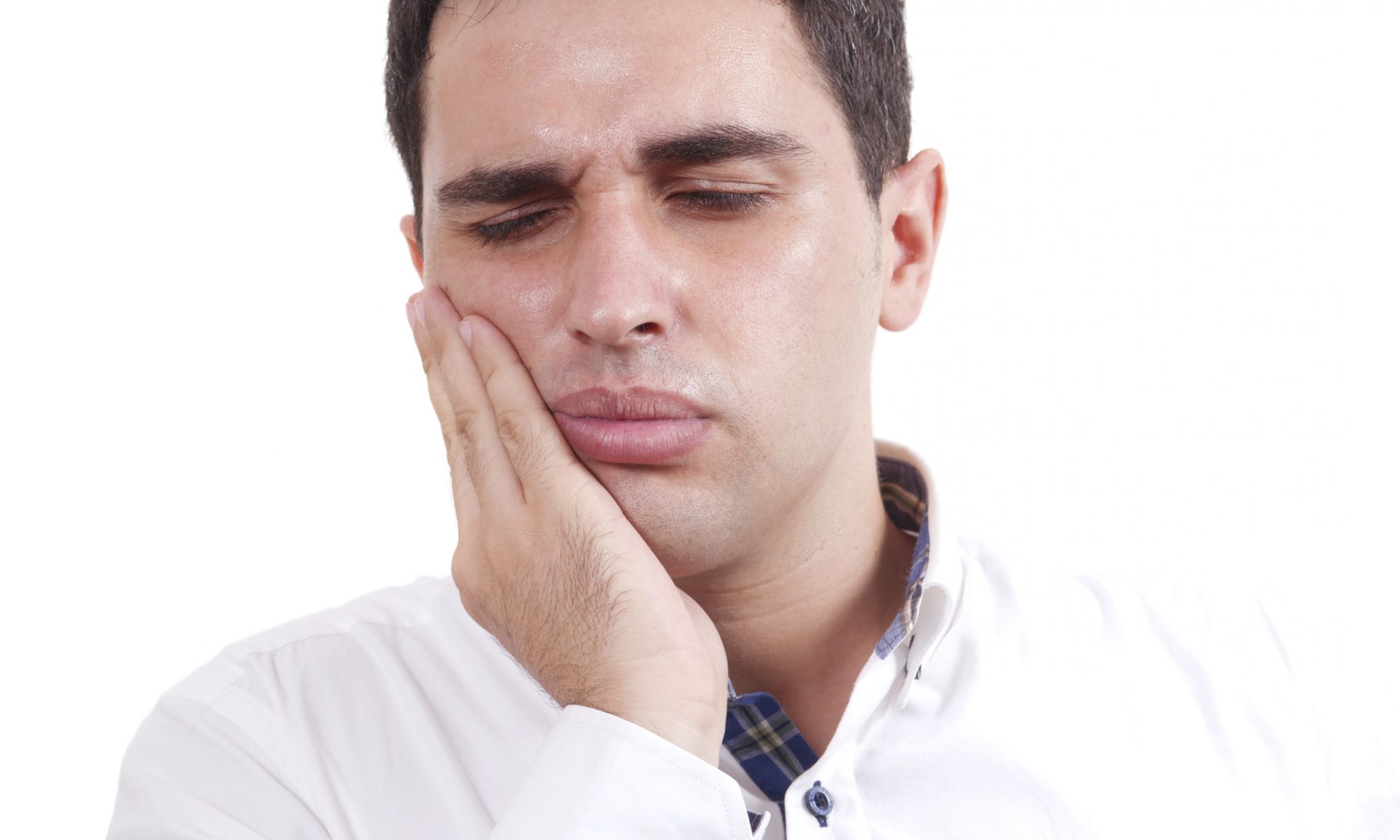 man with jaw pain caused by TMJ, or a cracked or broken tooth
